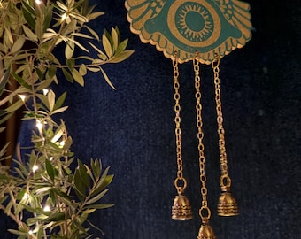 Chiming nazar evil eye Ancient Roman magic Tintinnabulum mobile