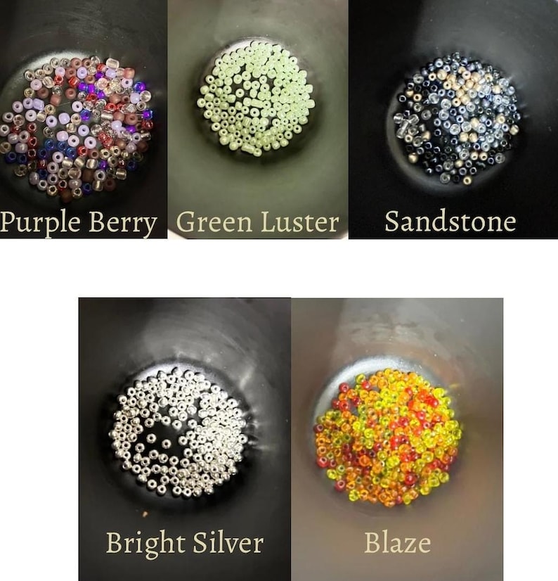 May include: Five small bowls filled with beads in various colors. The bowls are labeled "Purple Berry", "Green Luster", "Sandstone", "Bright Silver", and "Blaze". The beads are small and round, and the colors vary from purple and red to silver and yellow.