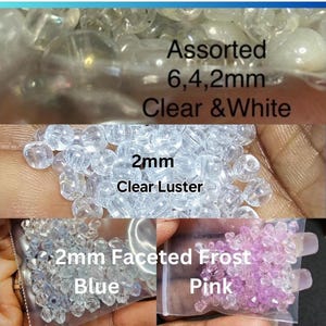 May include: Assorted clear and white beads in various sizes, including 6mm, 4mm, and 2mm. The image also shows 2mm clear luster beads, along with 2mm faceted frost beads in blue and pink. Text on the image reads "Assorted 6,4,2mm Clear & White".