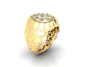 May include: A gold ring with a textured band and a round centre piece set with clear diamonds.