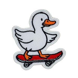 May include: Embroidered patch featuring a white duck with an orange beak and feet, riding a red skateboard. The duck is outlined in black, with black wheels on the skateboard. The patch has a white border.