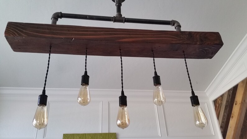 Steel Pipe Chandelier With Rustic Wood Beam Pendants Image 0