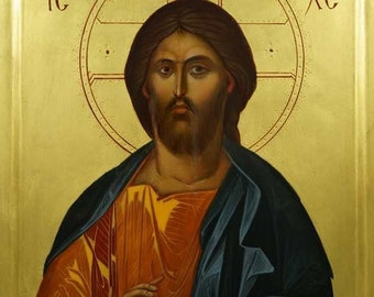 May include: A religious icon depicting Jesus Christ with a golden halo and holding a book. The icon is painted in a traditional style with vibrant colors and intricate details. The text "IC XC" is visible in the upper corners of the icon.