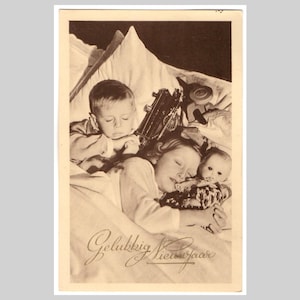 Retro real photo postcard - Sleeping children boy girl doll train - Vintage Belgian sepia rppc greeting card ca 1940