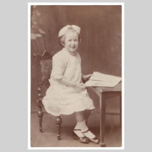 Antique rppc - Young girl 1910's white dress reads magazine - Vintage sepia private photo postcard ca 1915