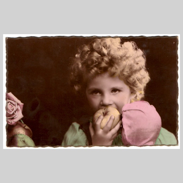 Vintage real photo postcard - Little girl child eats an apple curly blonde hair - Antique hand tinted French rppc greeting card ca 1930