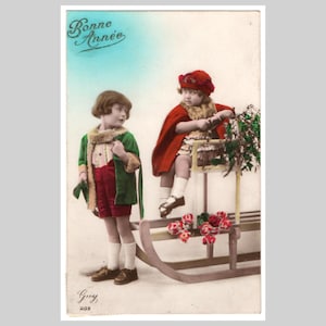 Cartolina fotografica d'epoca - Bambine in slitta di Natale, moda invernale, stile art déco - Antica cartolina d'auguri francese in stile rppc degli anni '20