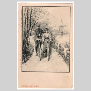 Carte postale cycliste ancienne - Un couple fait du vélo inutilisé - Carte de voeux autrichienne victorienne antique vers 1900