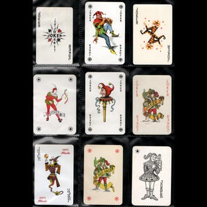 May include: Nine vintage playing cards featuring Joker designs. The cards display various illustrations of jesters in colorful outfits, with the word "JOKER" prominently displayed. Some cards have additional text, including "100% Plastic."