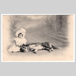 Vintage dog postcard - St saint bernard sleeping with little girl bonnet - Antique Swiss victorian greeting card ca 1900