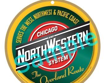 May include: A circular sign with a yellow border and a green and red centre. The sign features the text "SERVES THE WEST, NORTHWEST & PACIFIC COAST" and "CHICAGO AND NORTHWESTERN SYSTEM". The words "The Overland Route" are also displayed.