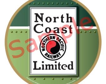 May include: A circular green and gold ornament with a rectangular sign displaying "North Coast Limited" and the Northern Pacific Railway logo. The background is green with rivet detailing.
