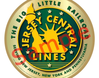 May include: A gold circular ornament with a green background and a yellow silhouette of the Statue of Liberty. The text "The Big Jersey Central Railroad Lines Serving New Jersey, New York and Pennsylvania" is printed around the edge.