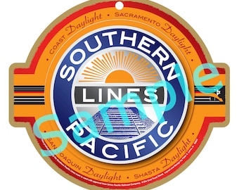 May include: A round, brown, vintage-style logo with a blue circle in the centre. The blue circle has a white sun with orange rays and the text "SOUTHERN LINES PACIFIC" in white. The text "COAST Daylight SACRAMENTO Daylight SAN JOAQUIN Daylight SHASTA Daylight" is written in a circle around the blue circle.