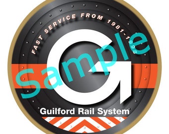 May include: A round, gold-coloured metal ornament with a black centre featuring a white letter G with an arrow pointing upwards. The text "Fast Service From 1981-1988" is written in a circle around the letter G. The text "Guilford Rail System" is written below the letter G. The ornament has a red and white striped pattern around the edge.