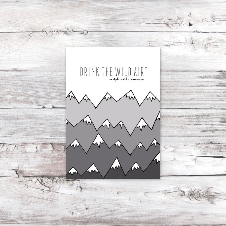 May include: A white printable art print with a black and gray mountain range design and the quote "Drink the wild air" - Ralph Waldo Emerson.