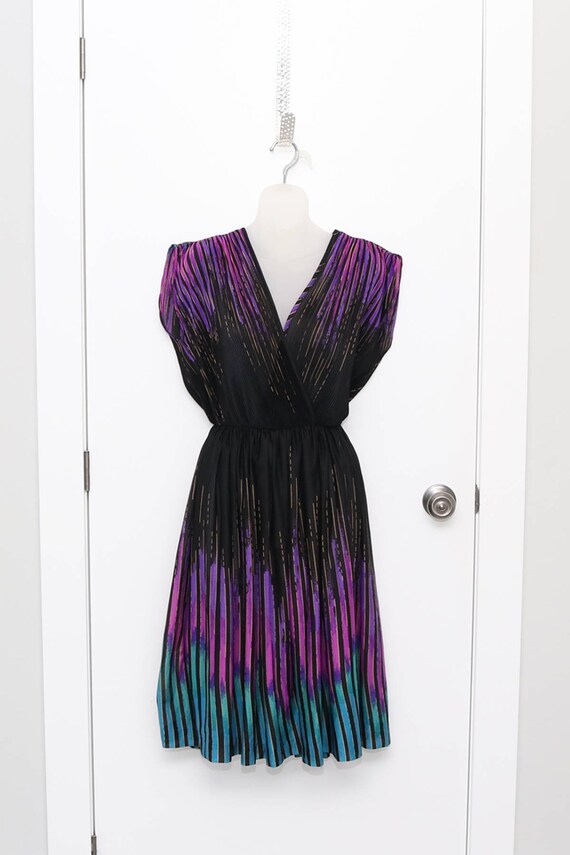 Little black 1970s dress with purple, pink, blue a
