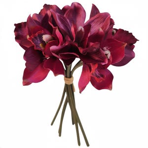 May include: A bouquet of deep burgundy artificial orchids. The flowers have multiple layers of petals and are tied together with twine. The stems are a dark green color, and the background is white.