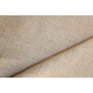 May include: A length of light brown burlap fabric featuring a coarse, open-weave texture with visible fibers. The material is folded over itself, creating a diagonal crease that highlights the rough, natural appearance of the woven textile.