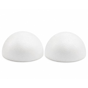 May include: Two white, smooth, hemispherical foam shapes with a textured, porous surface. These two identical half-sphere objects are positioned side-by-side, featuring a rounded top and a flat circular base, crafted from lightweight material.