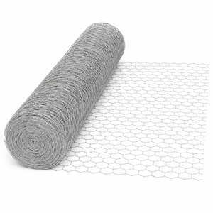 May include: A roll of silver-colored metal wire mesh featuring a consistent hexagonal pattern. The wire is tightly coiled into a cylindrical shape on one side, while a section of the mesh is unrolled and laid flat to display the grid structure.