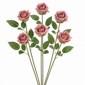 May include: Six faux roses with dusty rose-colored blooms and green leaves. The stems are a muted green color. The roses are arranged against a white background, creating a clean and elegant aesthetic. Perfect for home decor or crafting.