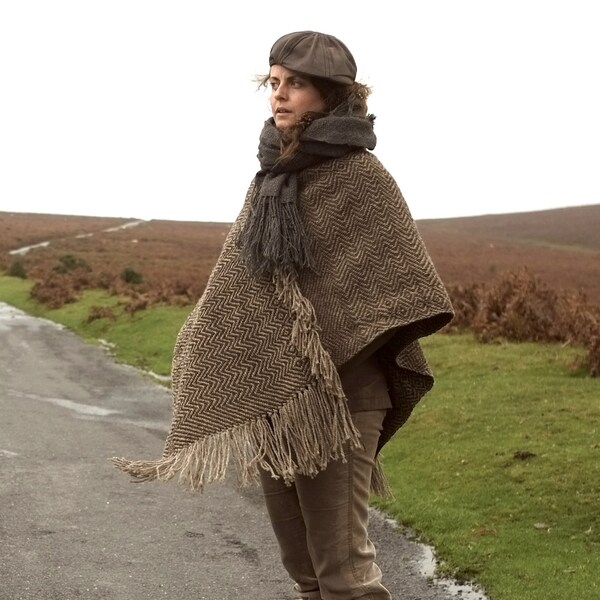 Women's or men's poncho or cape handwoven in rugged brown waxy wool in a Jacquard pattern