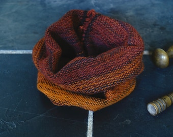 Hearth: small rust-red-orange-brown-black snug handwoven in Jacob and lambswool