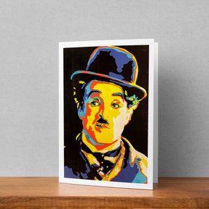 May include: A colorful pop art portrait of Charlie Chaplin wearing a black bowler hat. The image is rendered in bright yellow, red, blue, and green colors.
