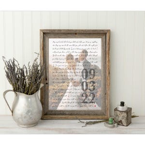 May include: A framed print with a handwritten message and a photo of a wedding couple. The date "09.03.22" is visible in the photo.