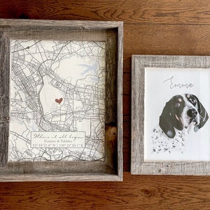 May include: Two framed prints, one with a map and a red heart marking a location, and the other with a black and white illustration of a dog with the name "Emma" written above it.