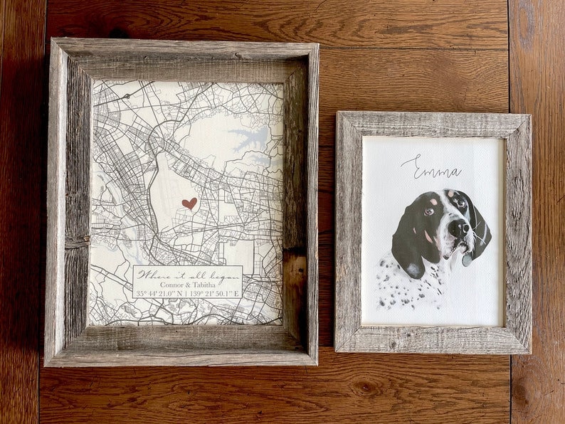 May include: Two framed prints, one with a map and a red heart marking a location, and the other with a black and white illustration of a dog with the name "Emma" written above it.