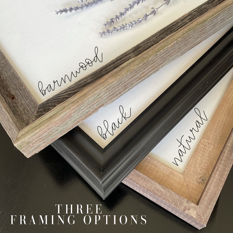 May include: Three framing options for a print or artwork: barnwood, black, and natural wood. The frames are stacked on top of each other, with the barnwood frame on top and the natural wood frame on the bottom.