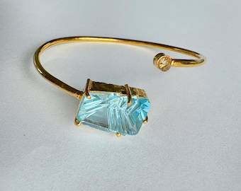 Blue topaz and white topaz gold plated sterling silver bracelet