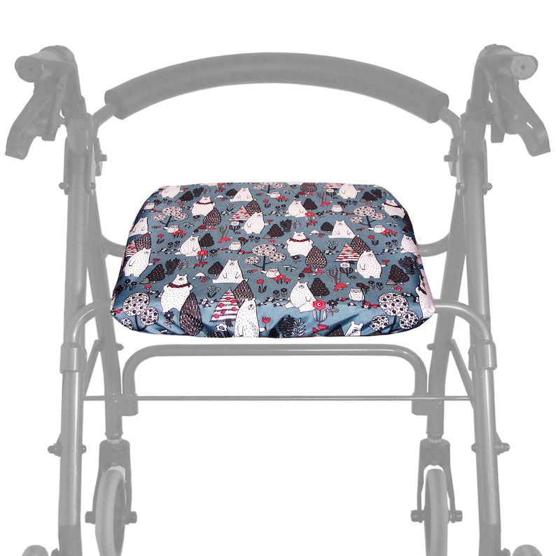 May include: A blue walker cushion with a white polar bear and mushroom print. The cushion is designed to provide comfort and support while using a walker.