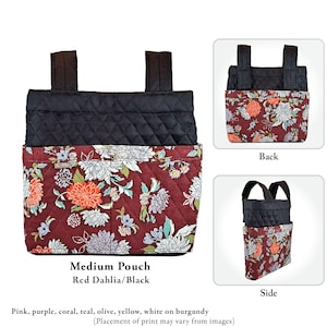 May include: A medium pouch featuring a quilted black upper section and a burgundy lower section with a floral print in pink, purple, coral, teal, olive, yellow, and white. The pouch includes two black straps and a small tag labeled C-Me.