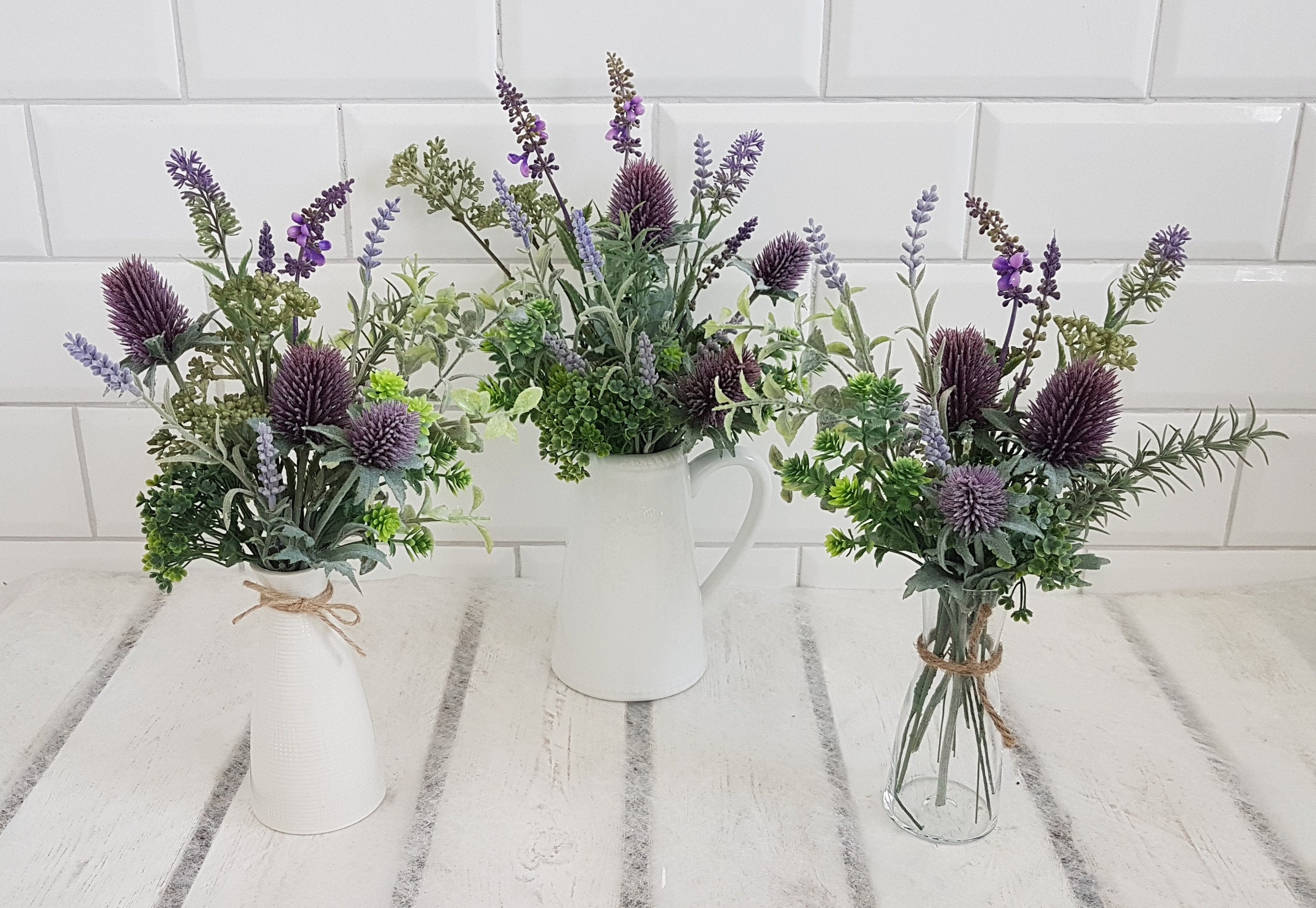 Image of Purple thistle flower in vase