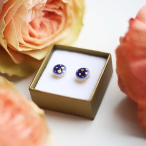 Stunning navy stud earrings with gold dots pattern. Small 8mm in diameter.
