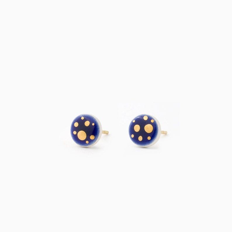 Stunning dark blue stud earrings with gold spots. Small 8mm in diameter.