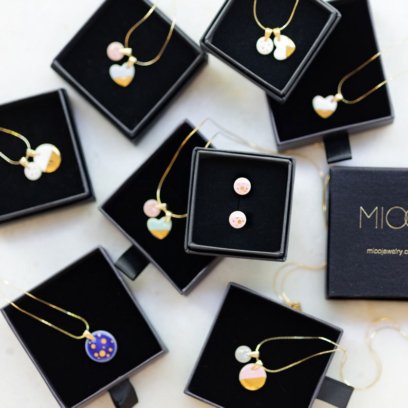 ceramic jewelry ceramic earrings with gold dots and ceramics necklaces, ceramic pendants.
Jewelry in boxes, different patterns. MIOO jewelry