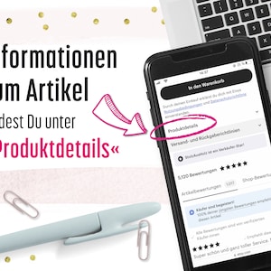 May include: A black smartphone displaying an Etsy product page with German text, including the phrase "Informationen zum Artikel findest Du unter Produktdetails". A pink arrow points to the "Produktdetails" section. A light blue pen and two silver paper clips are visible.
