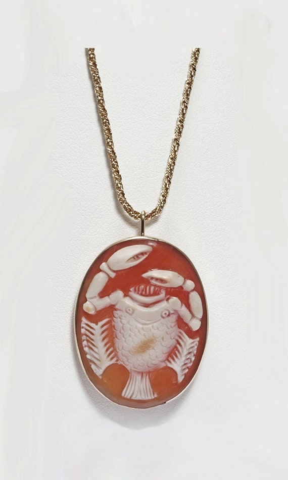 Cameo unusual crab-fish carved shell cameo pendant brooch set in 18 karat yellow gold.