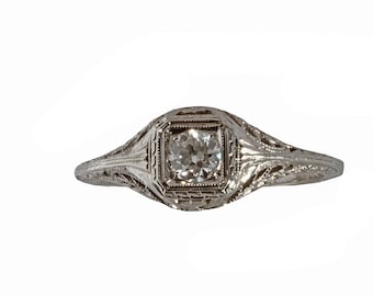 Filigree vintage diamond engagement ring 18 karat white gold 0.25 carat estimated weight diamond.