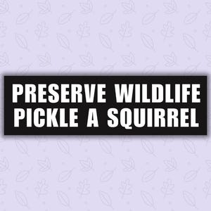 May include: A black and white sign with the text "Preserve Wildlife Pickle a Squirrel" on a light purple background with a pattern of small leaves.