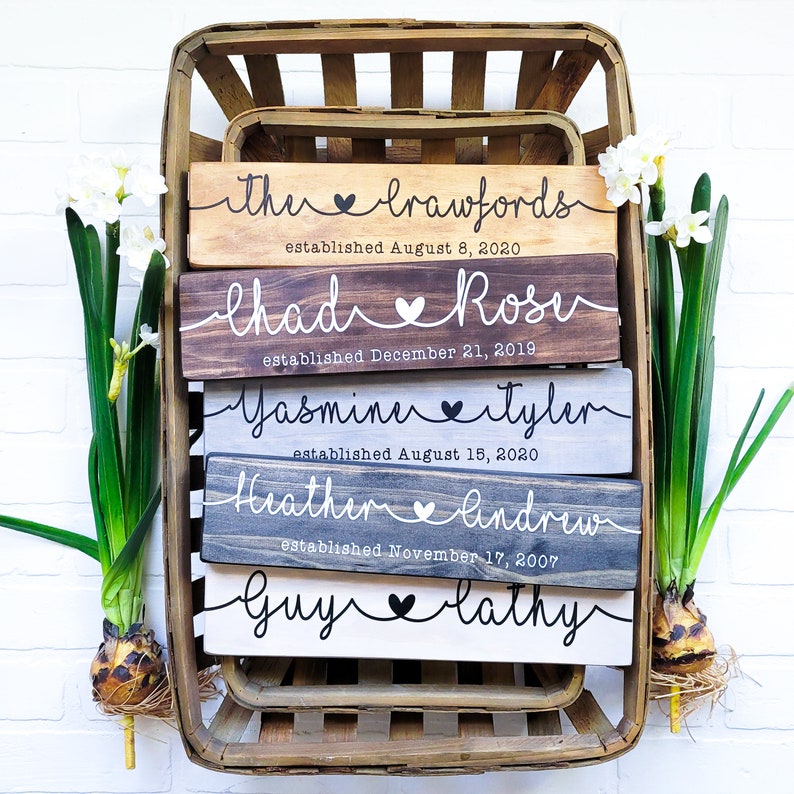 Celebrate the love between two people with our personalized couple name signs! Handcrafted from select pine wood. Add custom names and anniversary date for a unique gift. Perfect for weddings, anniversaries, or Valentine's Day.