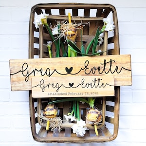 Celebrate the love between two people with our personalized couple name signs! Handcrafted from select pine wood. Add custom names and anniversary date for a unique gift. Perfect for weddings, anniversaries, or Valentine's Day.