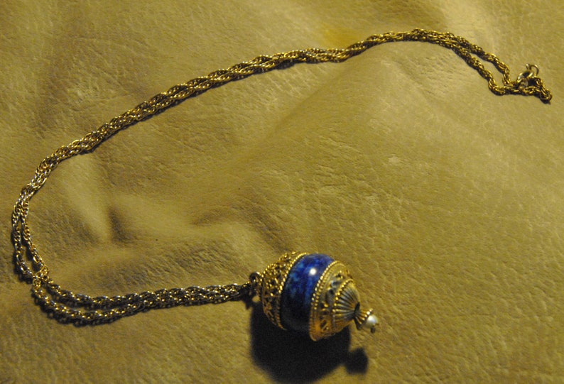 Round Dark Blue and Gold Colored Hinged Pendant with Scent image 1