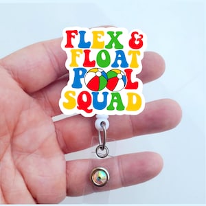 May include: A white badge reel with the text "FLEX & FLOAT POOL SQUAD" in red, yellow, blue, and green. The badge reel features two beach balls and a retractable cord with a metal clip and a decorative iridescent button.