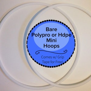 May include: Two white mini hoops are displayed against a white background. The hoops are made of a smooth, round material. A blue and black circular graphic in the image reads "Bare Polypro or Hdpe Mini Hoops" and "Comes w/ Grip Tape for Free!"