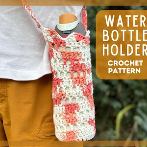 May include: A handmade crochet water bottle holder in a white and coral color scheme. The holder is designed with an open weave pattern and includes a strap for carrying. The image also displays the text "WATER BOTTLE HOLDER CROCHET PATTERN".